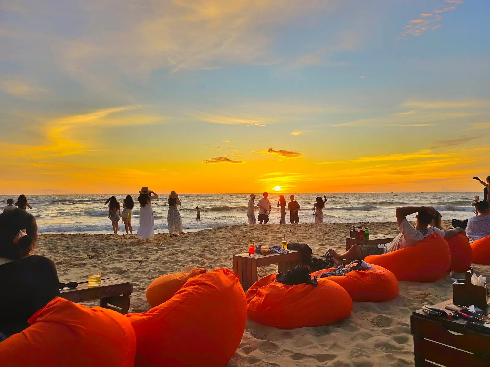 Beanbags on the sand at OCSEN Beach Bar on Long Beach at sunset