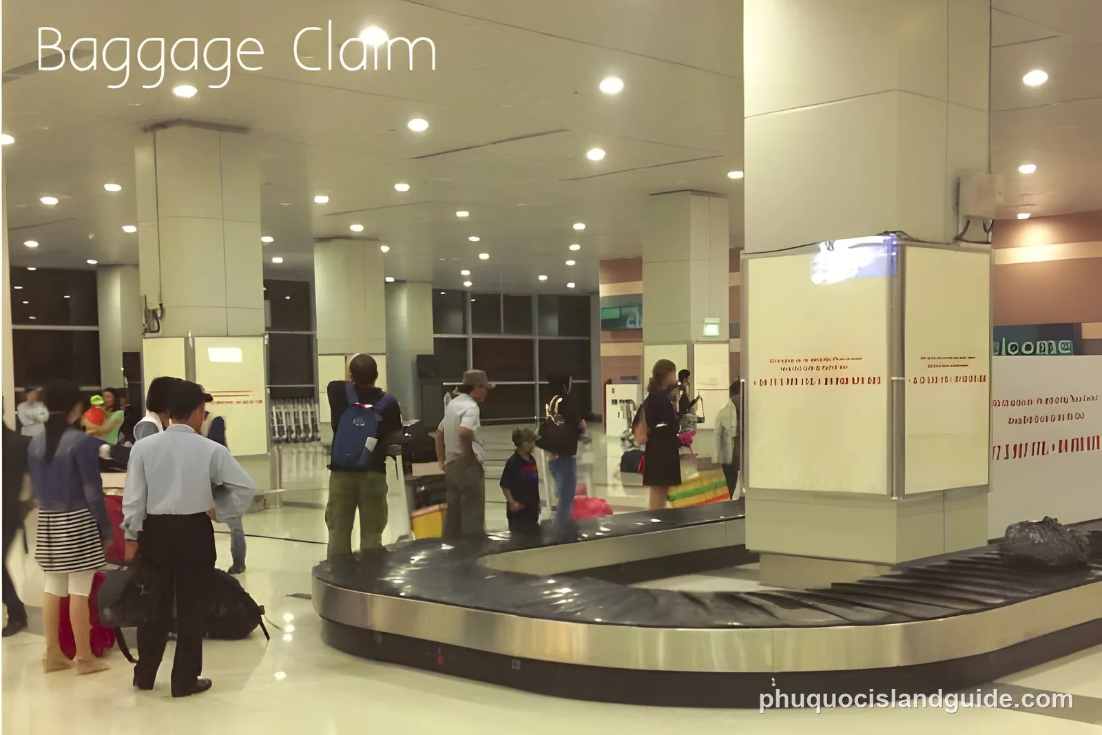 The arrivals area at Phu Quoc International Airport, with the baggage belt, exit doors and passengers collecting luggage.