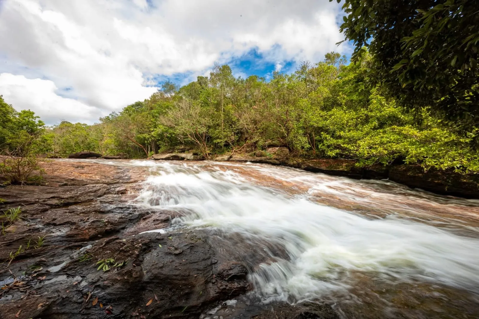 Water running over granite slabs at Da Ban stream in Cua Duong