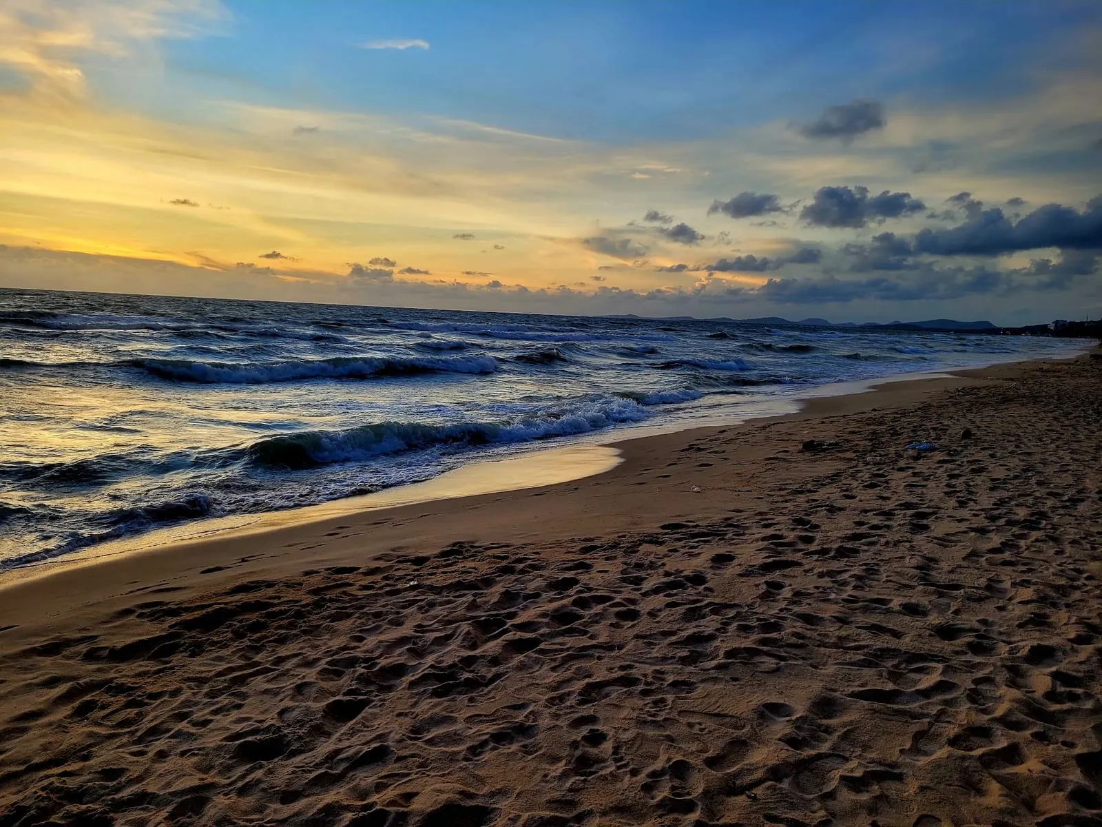 Waves on the sand at Long Beach, Phu Quoc, at sunset